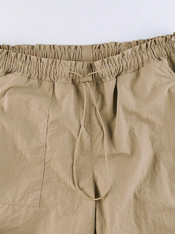 Pantalones cargo de paracaídas con cordón y bolsillo de tamaño accesible