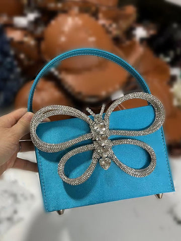 Clutch de mariposa con diamantes de imitación