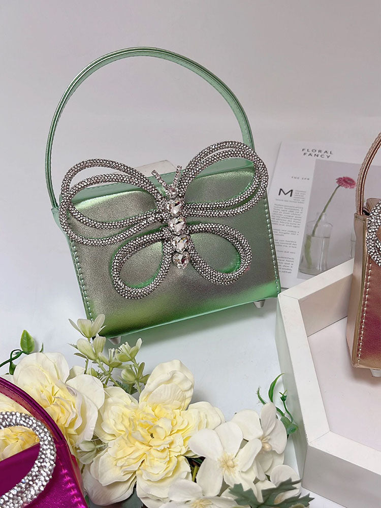 Clutch de mariposa con diamantes de imitación