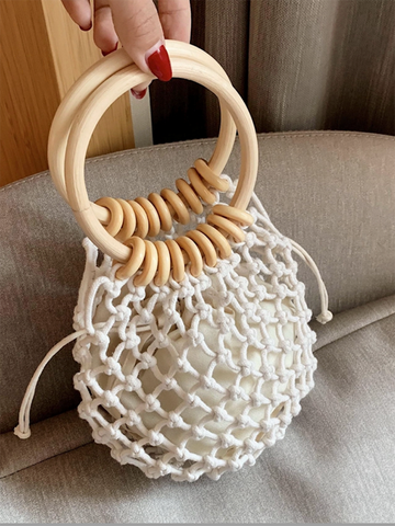 Bolso de mano con asa de tejido hueco