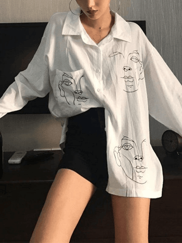 Blusa de manga larga con estampado de rostro abstracto