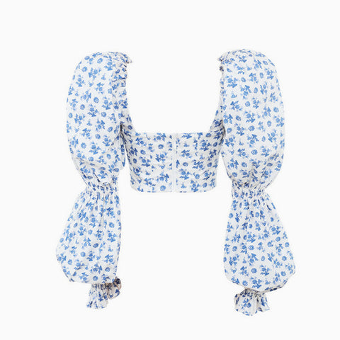 Top corto con estampado floral, mangas abullonadas y lazo frontal - Blanco