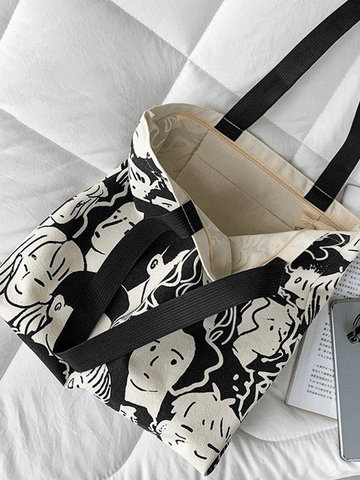 Monochrome Canvas-Shoppertasche mit Gesichtsgrafik