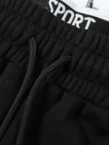 Pantalones deportivos holgados con cintura con tiras y detalle de ribete