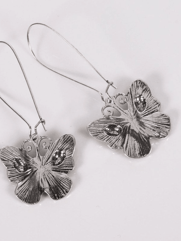 Pendientes de calavera y mariposa