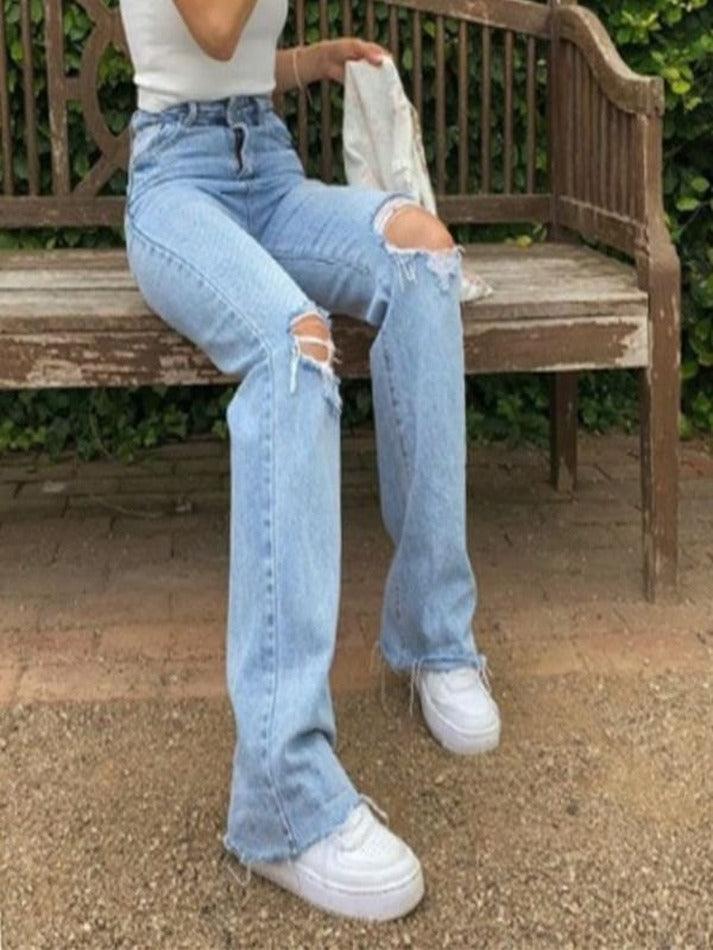 Verwaschene Jeans mit hoher Taille und Rissen am Knie