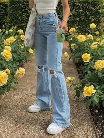 Verwaschene Jeans mit hoher Taille und Rissen am Knie